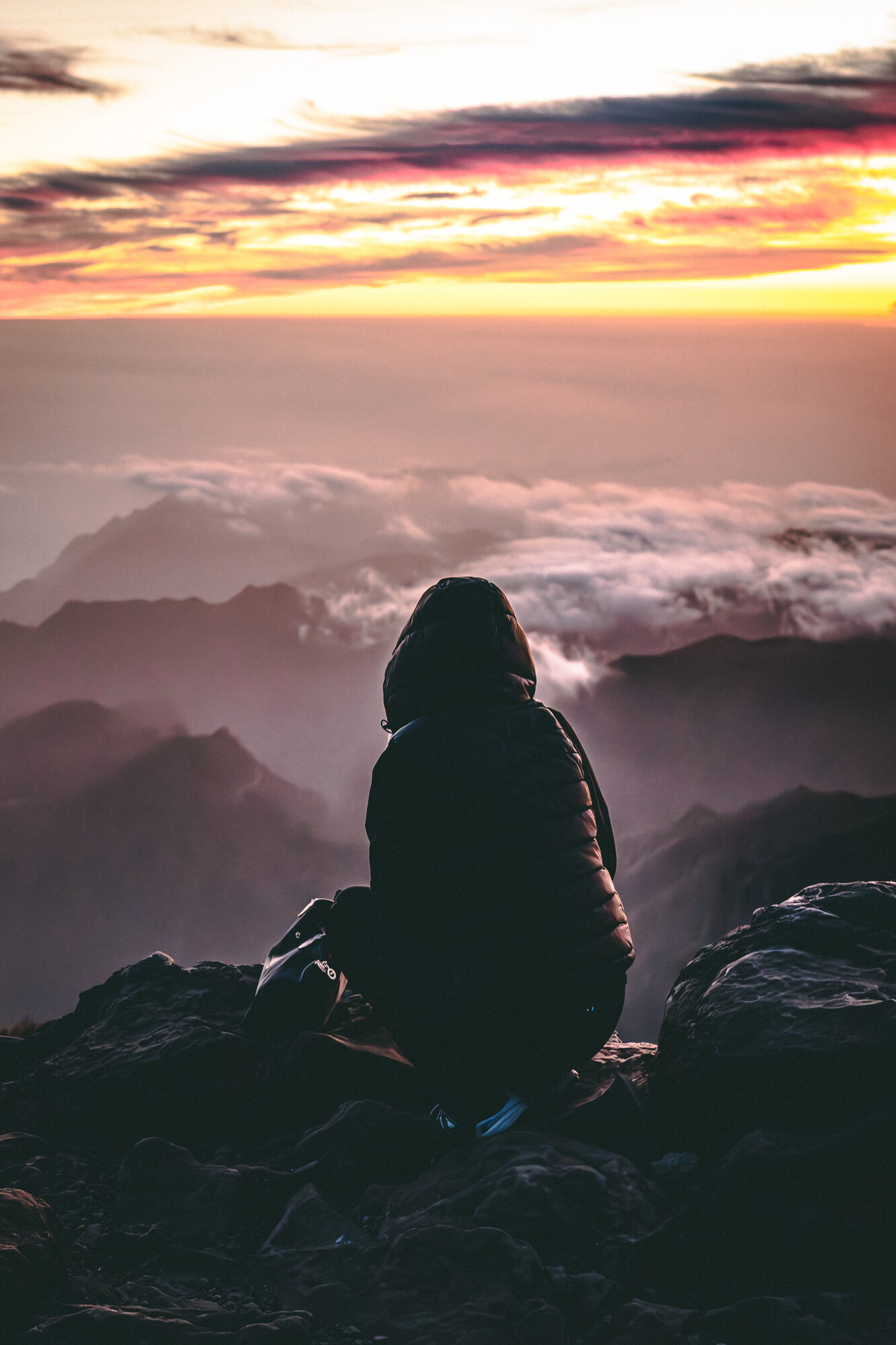 Mountain sunset above the clouds
